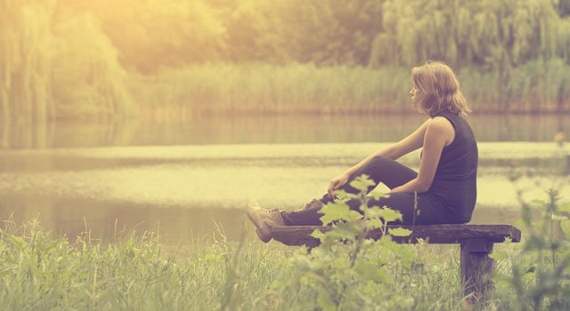 sad woman sitting outside