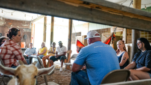 Alumni having a meeting in the barn at JourneyPure