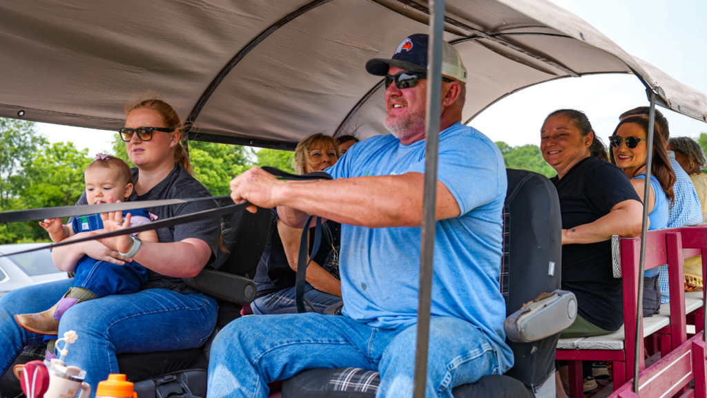 Jon Levi piloting the horse carriage through the JourneyPure campus
